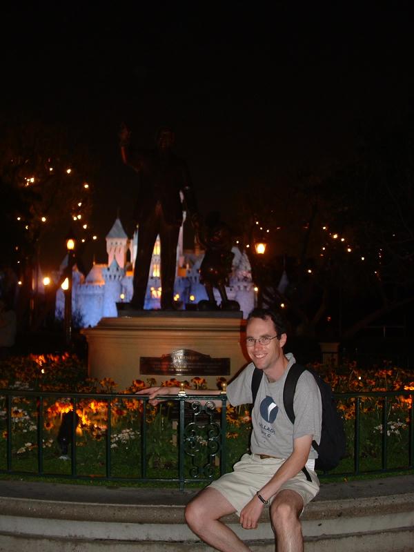 Rob, with Walt Disney and Mickey, and the Sleeping Beauty Castle in the background.