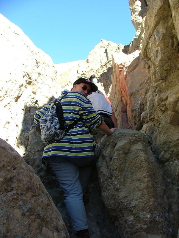 Jo climbs up a dry fall, Geological Ranger led walk, Gower Gulch, Death Valley National Park