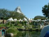 The Matterhorn Bobsled ride in the background of Storybook Land.