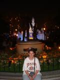 Jo, with Walt Disney and Mickey, and the Sleeping Beauty Castle in the background.