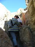 Jo climbs up a dry fall, Geological Ranger led walk, Gower Gulch, Death Valley National Park